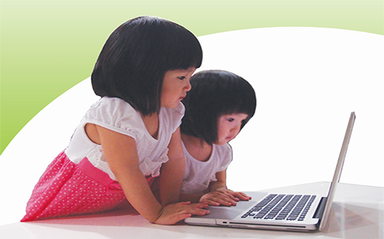 young girls using a laptop