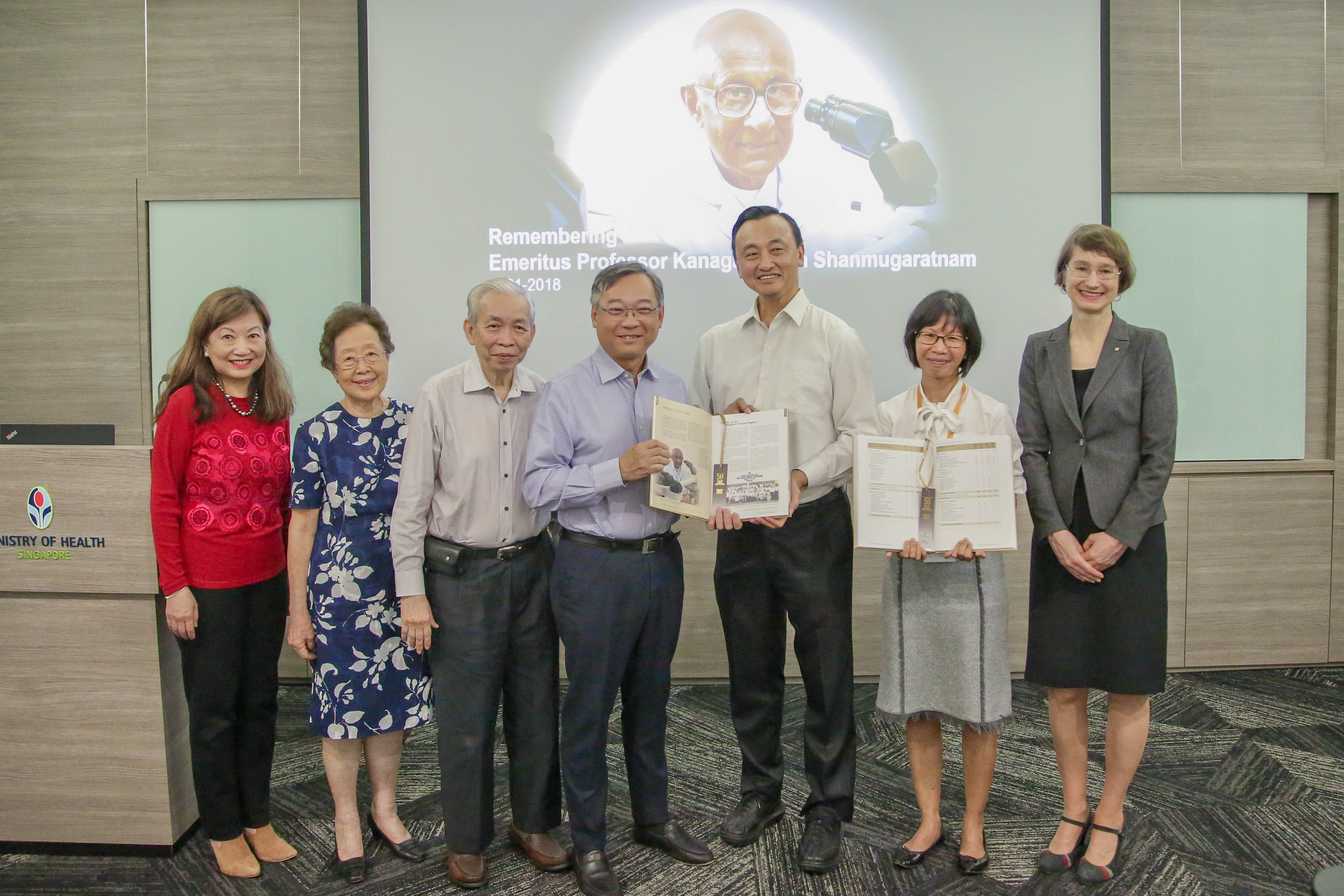 Minister for Health Mr Gan Kim Yong with the pioneers and advisors to the Singapore Cancer Registry 50th Anniversary Monograph