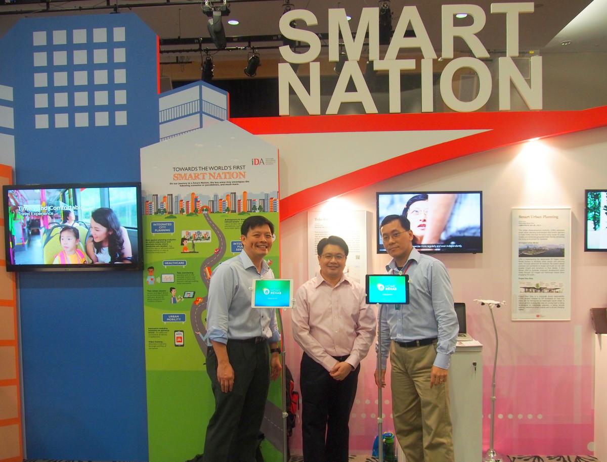 A/Prof Gerald Koh, A/Prof Arthur Tay, and Dr Yen Shih Cheng at the tele-rehab booth during the 2014 National Day Rally.