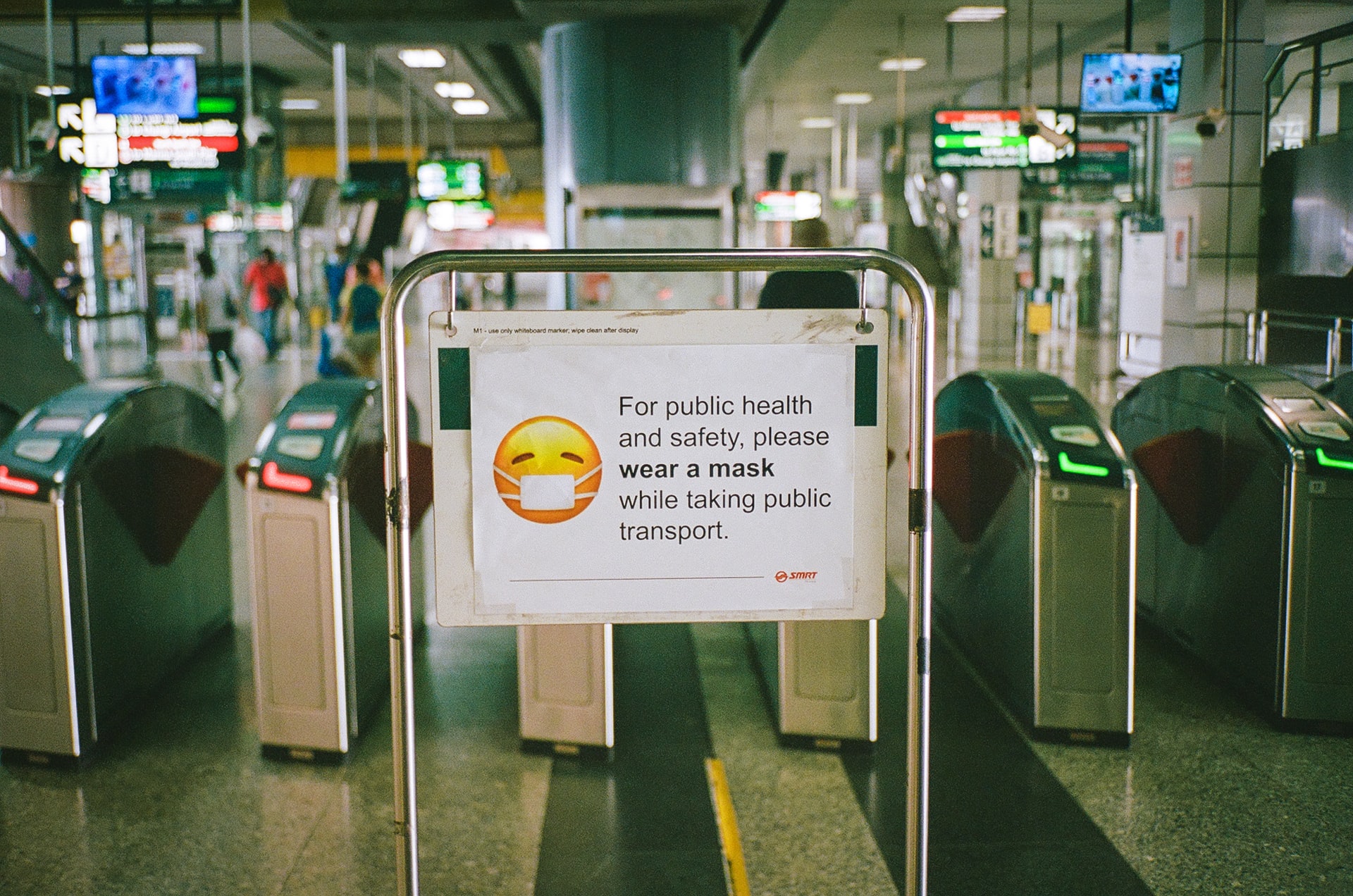 A sign at a train station in Singapore informing passengers to wear a mask at all times