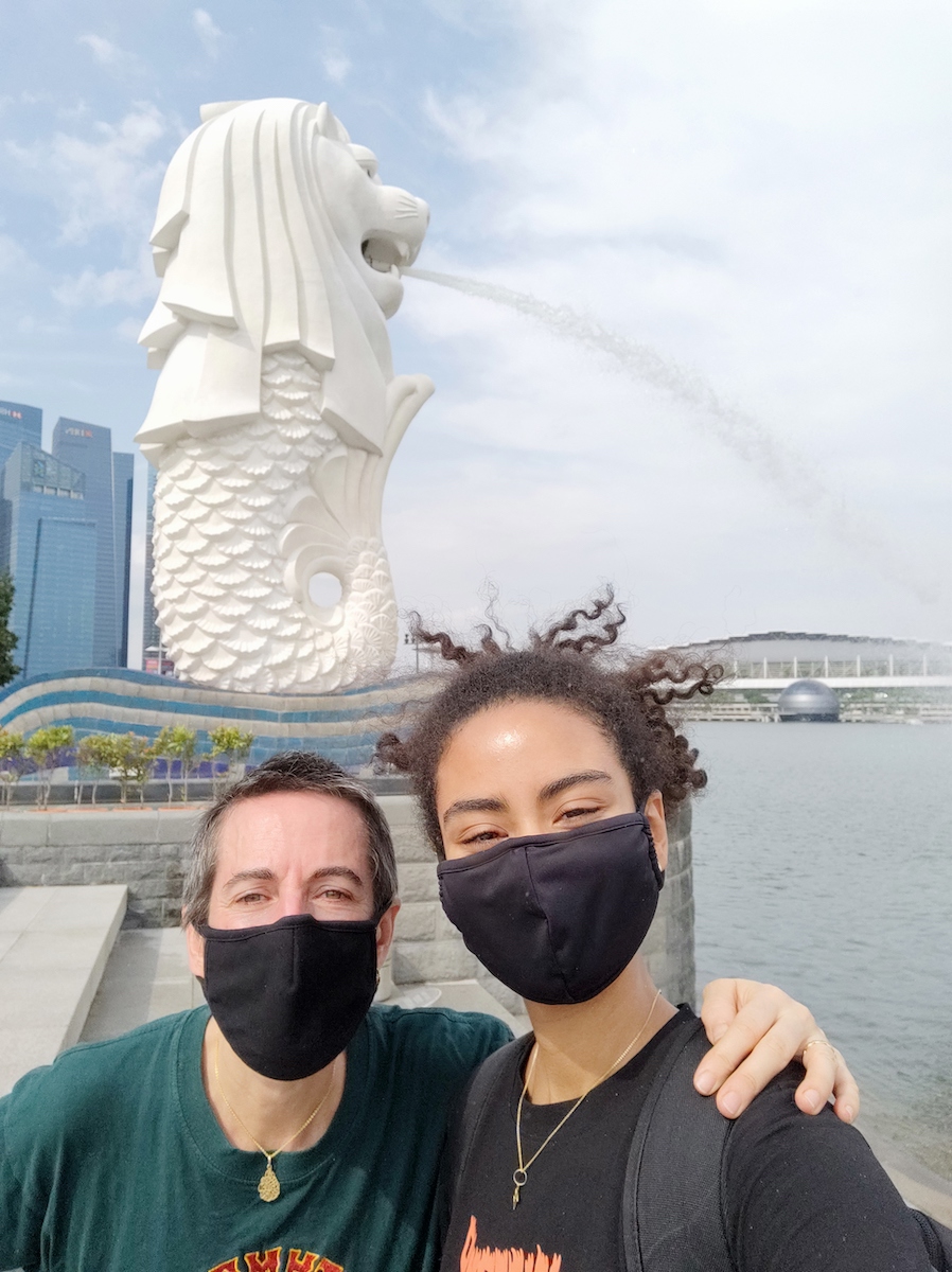 Natasha Howard and her daughter in front of the Merlion
