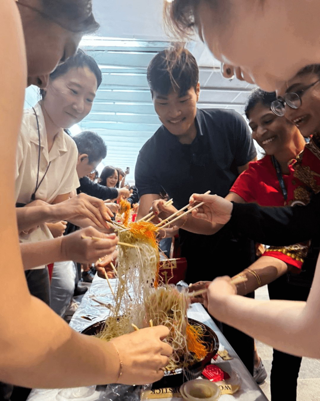 CNY 2026 lohei close-up shot CNY 2026 lohei close-up shot