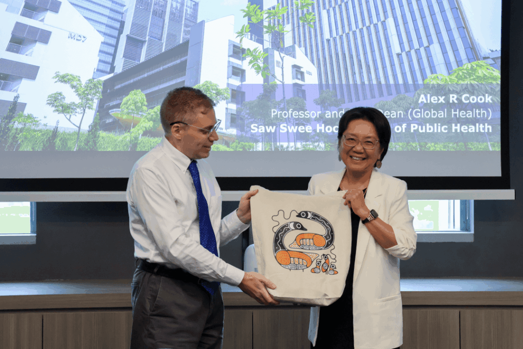 Prof Alex presenting item to Dean Prof. Lili Liu Prof Alex presenting item to Dean Prof. Lili Liu