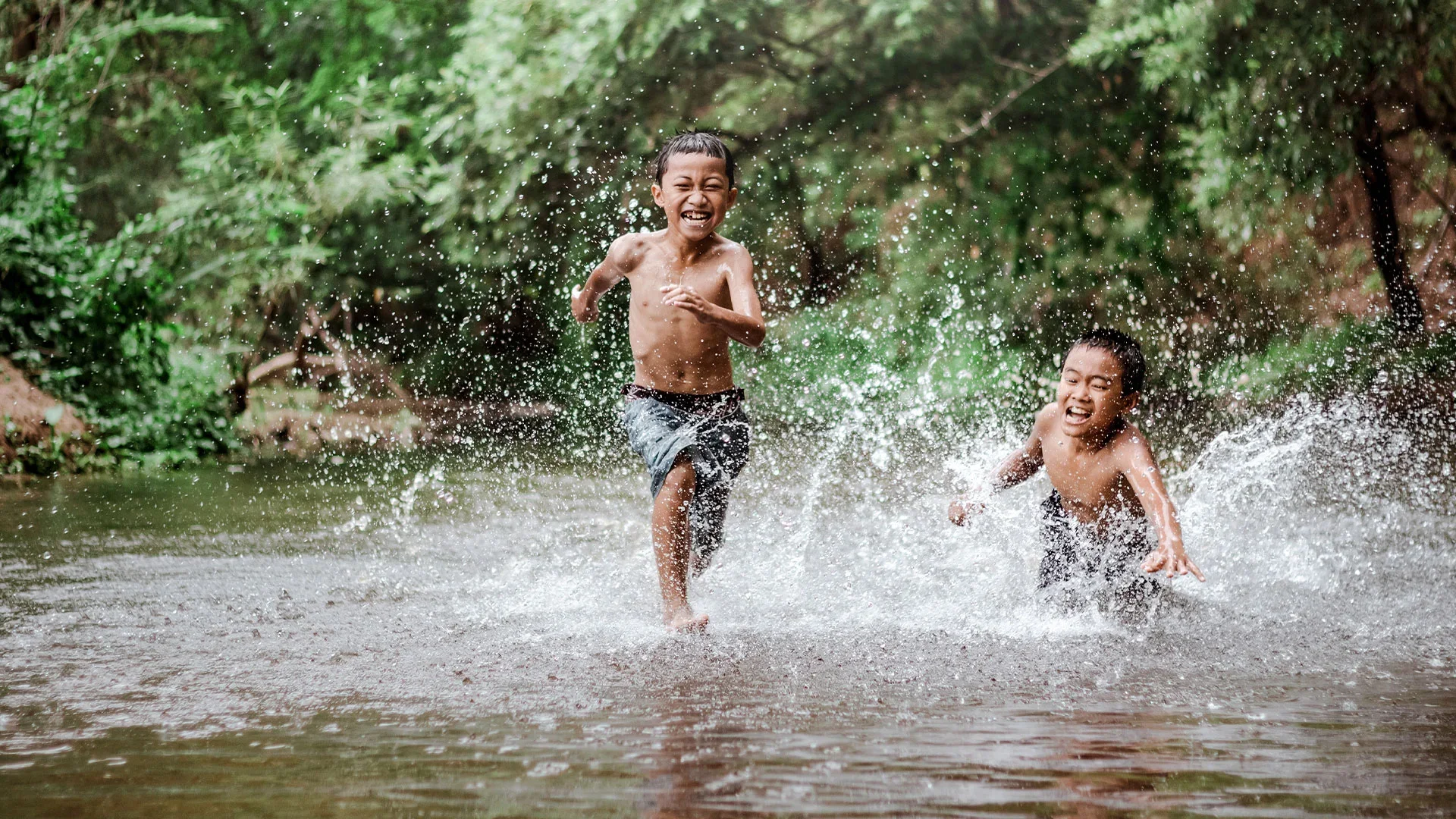 Rural-children-playing-water